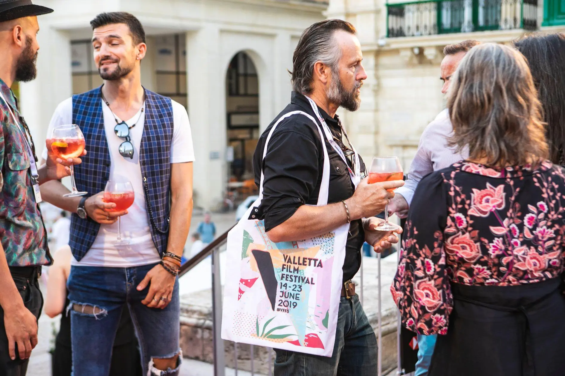 Visual identity series for Valletta Film Festival featuring annual poster designs, merchandise, programs, and motion graphics reflecting the citywide film celebration.