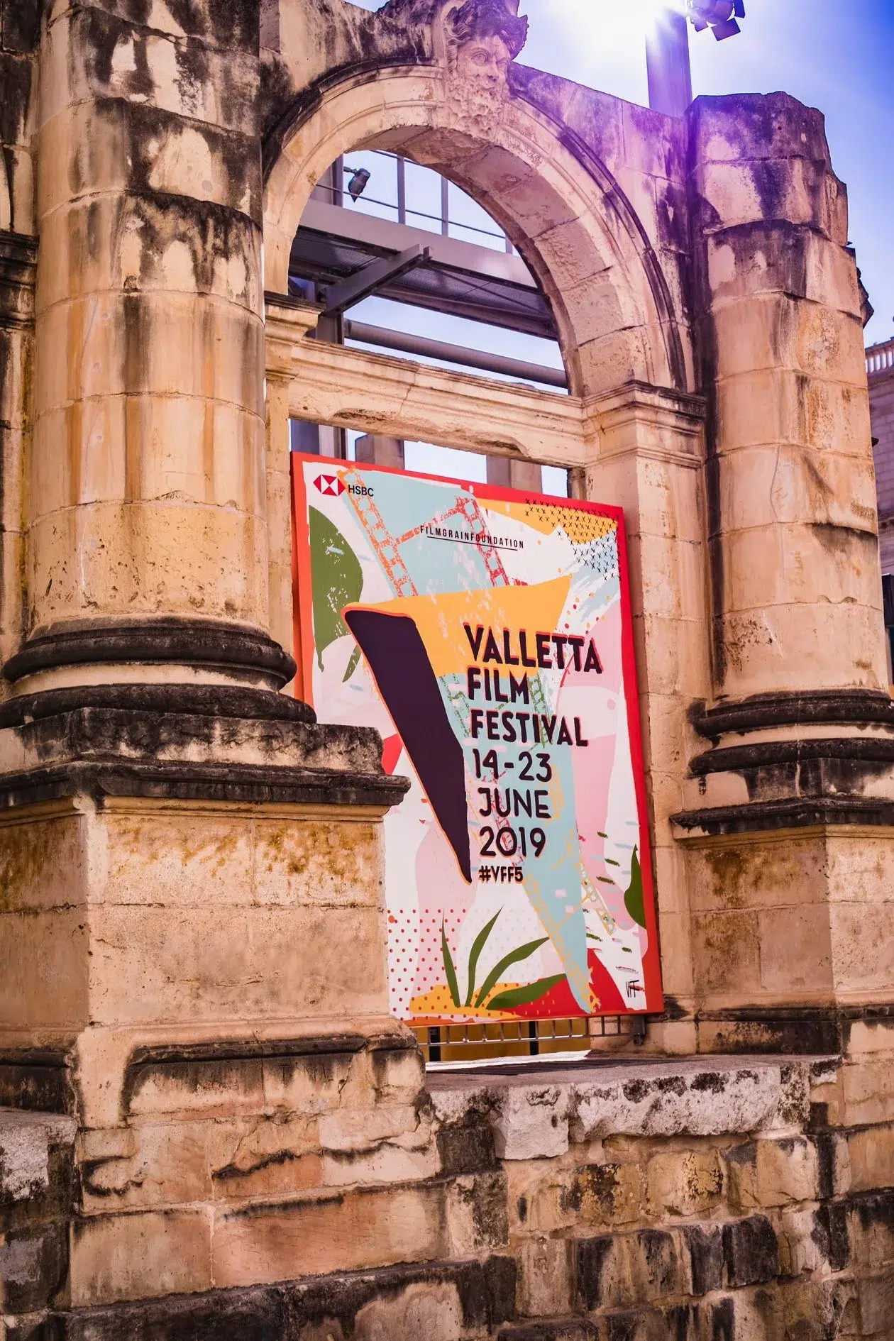 Visual identity series for Valletta Film Festival featuring annual poster designs, merchandise, programs, and motion graphics reflecting the citywide film celebration.