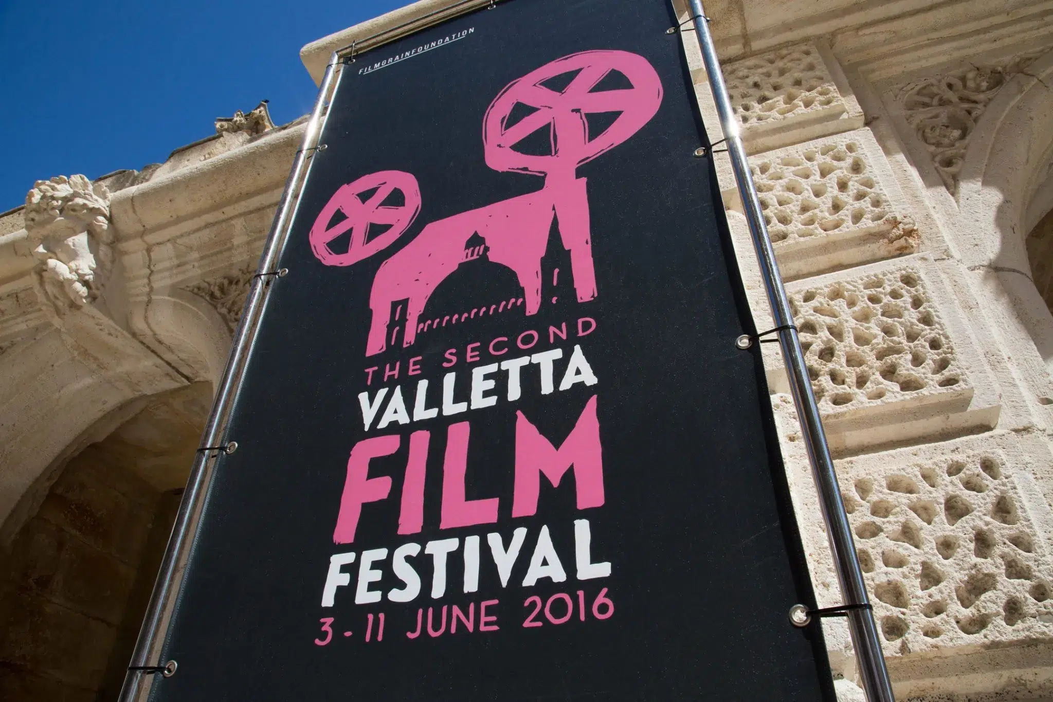 Visual identity series for Valletta Film Festival featuring annual poster designs, merchandise, programs, and motion graphics reflecting the citywide film celebration.